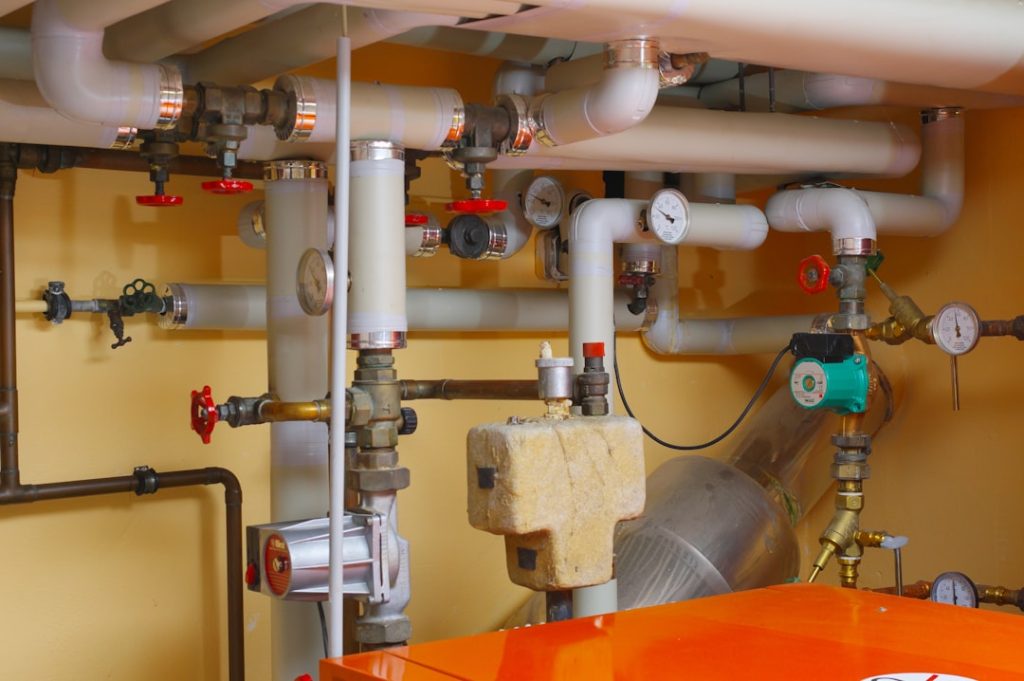 pipes-and-valves-in-a-room-with-orange-table-u0jpgktmtwe